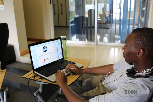 Shepherd  Chabata, who was doing graphics work for iDzodzo, works at his machine.