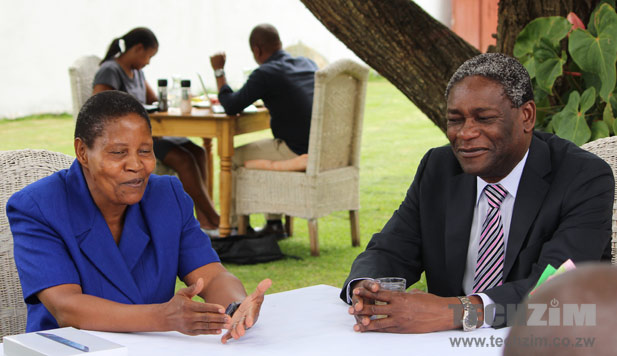 Marnet Mpofu, left, speaks at an event hosted by Luke Ngwerume