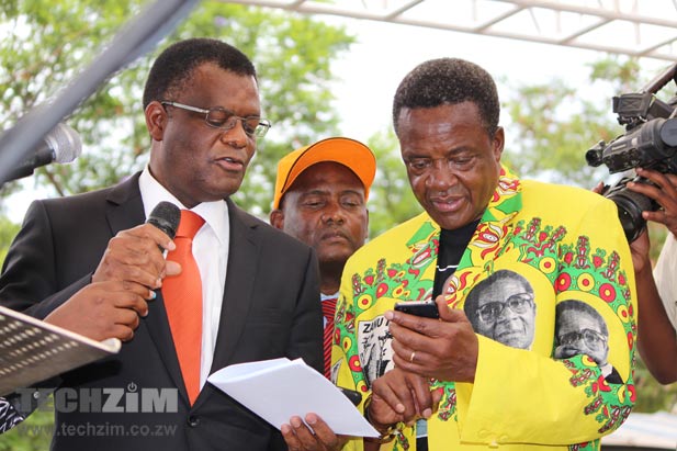 Minister Shamu in party regalia at a NetOne official event. On the left is NetOne MD, Reward Kangai.