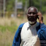 old man on phone, pensioner biometric registration