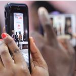 Woman watching live video on Facebook