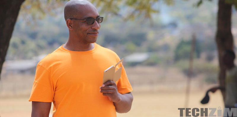 Man holding phone and smiling