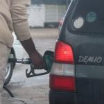 Man filling a car up with fuel prices New ZImbabwe