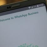 A phone showing WhatsApp Business start screen