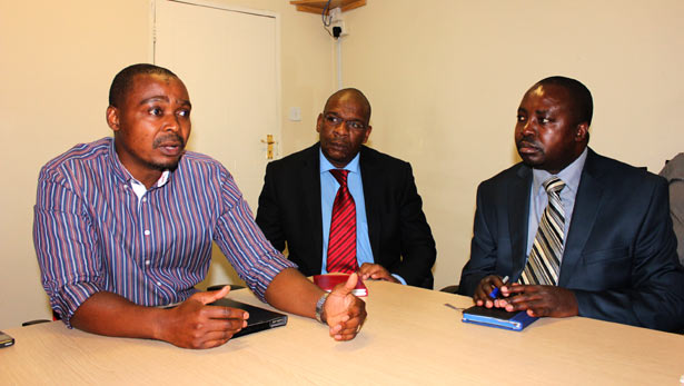 Darlington Mandivenga (left) addressing journalists today